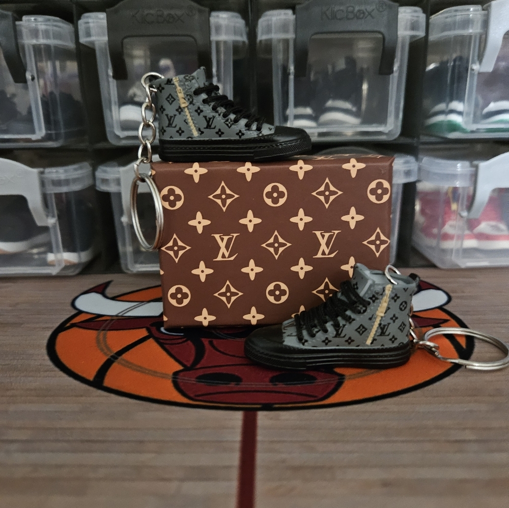 Fashion pair of mini sneakers keychain.